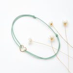 Bracelet coeur d'artichaut en coton caché dans une véritable coquille d'oeuf