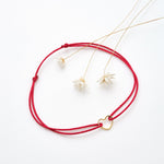 Bracelet coeur d'artichaut en coton caché dans une véritable coquille d'oeuf