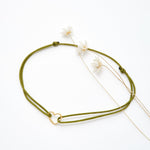 Bracelet coeur d'artichaut en coton caché dans une véritable coquille d'oeuf
