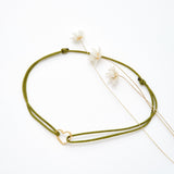 Bracelet coeur d'artichaut en coton caché dans une véritable coquille d'oeuf