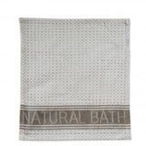 “Natural bath” embossed hand towel